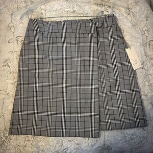 A new day plaid wrap around skirt. Size 2. Brand new, tags still on